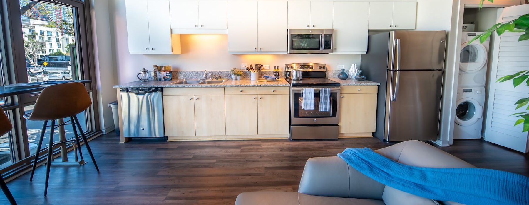 a kitchen with a couch and a table