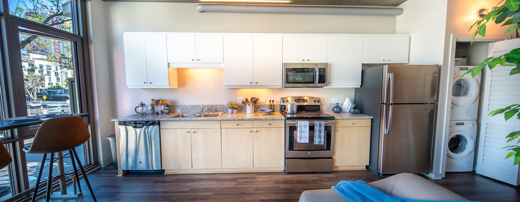 a kitchen with a couch and a table