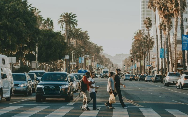Settle into comfort at Tenth&G people crossing a street