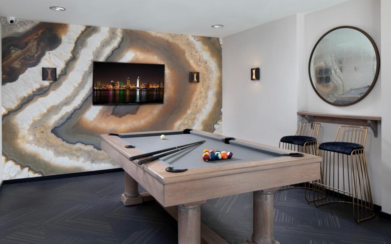 a pool table in a clubhouse room