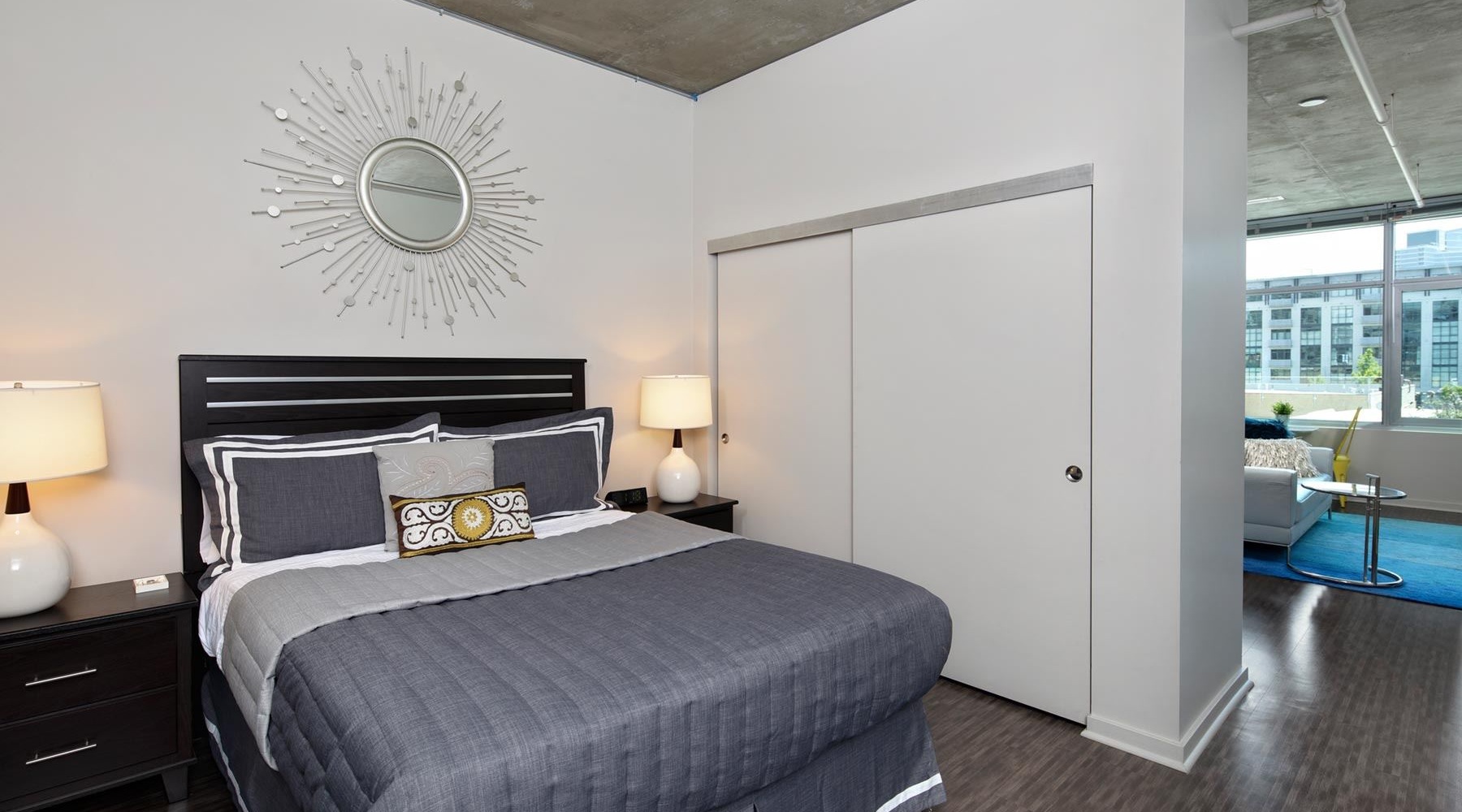 a bedroom with a bed and two nightstands