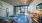 a living room, a kitchen with a large window
